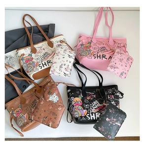 Detail view of four colorful graffiti tote bag sets featuring cute cartoon bears and cats