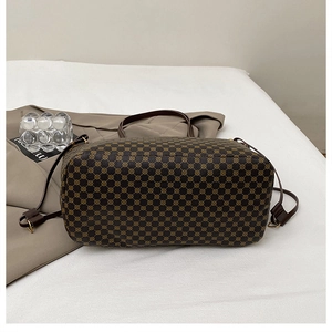 Detailed macro view of vintage tote bag with geometric logo print and detachable strap