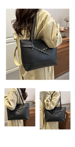 Detail of black tote bag featuring premium lychee texture leather and gold buckle hardware