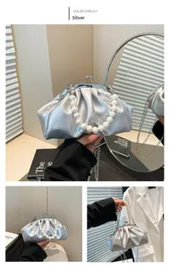 Detailed silver pleated cloud bag with pearl handle and vintage clasp closure