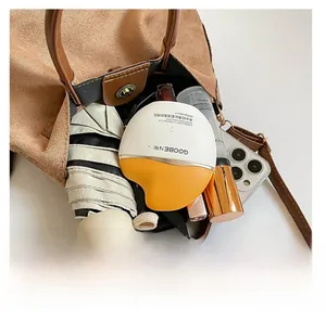 Top view of large brown suede bucket bag interior showing capacity for daily essentials