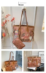 Detailed view of brown tote bag set with cute cartoon graffiti and matching wristlet