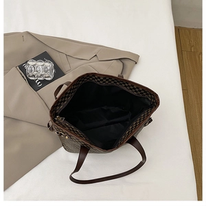 Internal view of the printed tote bag showing spacious black lining and zipper closure