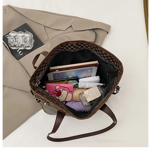 Detail view of large vintage tote bag interior showing spacious capacity for daily items