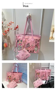 Pink graffiti tote bag set featuring cartoon prints and stylish wide shoulder strap
