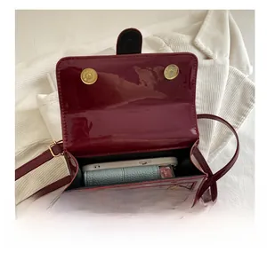 Interior view of wine red crocodile embossed crossbody bag showing daily essentials storage