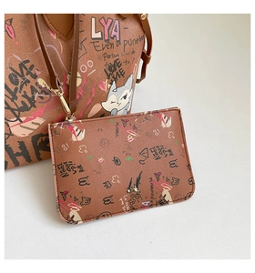Detail view of brown graffiti tote bag with detachable small matching pouch and fox print
