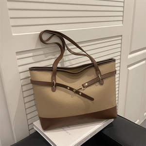 Large beige and brown contrast tote bag with gold buckle and pebble leather texture