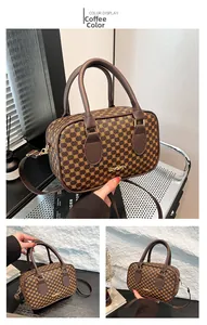 Detail of coffee-colored Boston bag featuring geometric monogram texture and metal logo