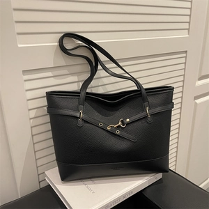 Large black lychee pattern tote bag with gold metal buckle detail and crossover straps