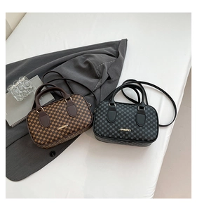 Top view of two classic boston shoulder bags with geometric patterns in brown and black