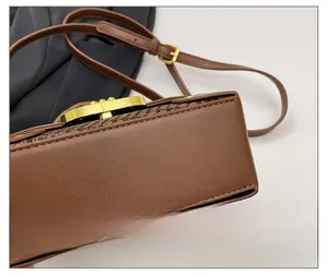 Detailed close-up showing reinforced stitching and premium leather texture of the tote bag