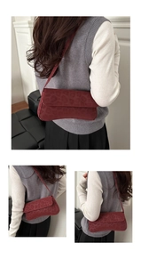 Three-way view of deep red leopard print shoulder bag with vintage flap design