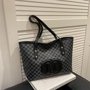 Large capacity tote bag with embossed letter M monogram and black leather straps