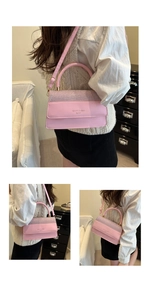 Detailed view of a pink crossbody bag with sparkling gradient rhinestones and shoulder strap