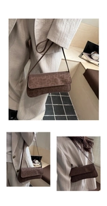 Detail of dark brown leopard print baguette bag in a vintage faux suede texture