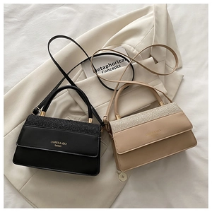 Detail of Korean style crossbody bags with textured stitching and light gold hardware
