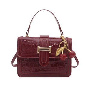 Elegant wine red crocodile pattern handbag with gold cherry charm and adjustable strap