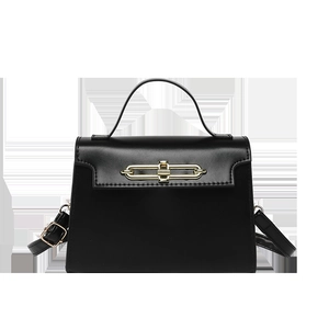 Minimalist black leather tote bag with gold metal hardware and adjustable shoulder strap