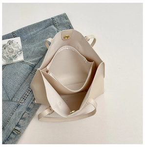 Top view of large cream tote bag interior with zipper pouch and magnetic buckle
