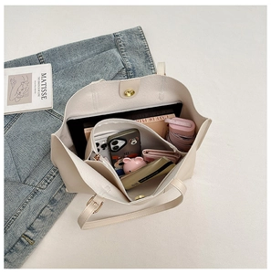 Interior view of large beige tote bag showing high storage capacity and magnetic closure