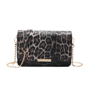 Minimalist leopard print flap bag with gold chain strap for shoulder and crossbody use