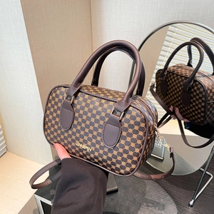 Classic dark brown Boston bag with golden pattern and adjustable shoulder strap