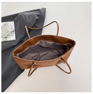 Spacious interior of the brown leopard tote bag with grey lining and a zip pocket