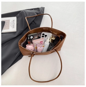 Top view of brown leopard tote bag interior showing large capacity and daily essentials
