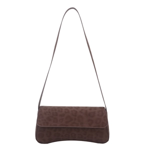 Chic brown leopard print shoulder bag with suede texture and flap closure in a minimalist style