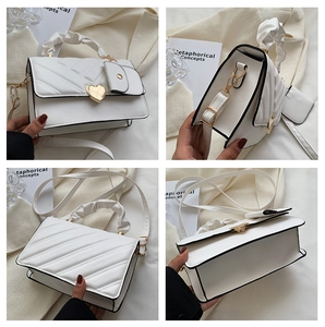 Quilted white PU handbag detail view showing heart lock, ruched handle and coin purse
