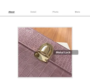 Detailed close-up of a pink faux crocodile leather bag featuring a gold metal clasp