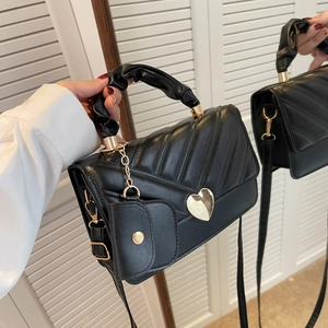 Fashionable black PU leather quilted handbag with gold heart buckle and mini charm bag