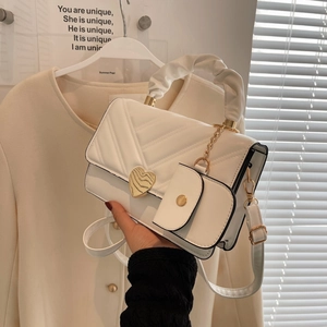 Chic beige quilted PU handbag with gold heart clasp and cloud handle including charm