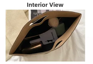 Interior view of beige leather tote bag with black fabric lining and small inner pocket