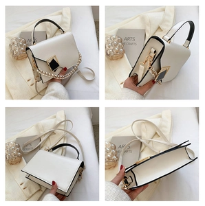 Detailed views of a white vintage square handbag featuring black trim and metal buckle