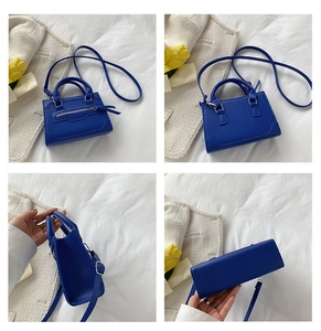 Detail view of Klein blue mini handbag showing front, back, and side views with silver hardware