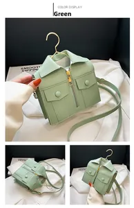Detailed view of macaron green jacket-shaped handbag with zippers and lapel decor