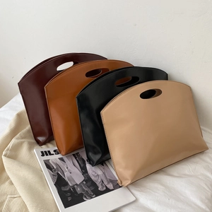 Minimalist PU leather tote bags in four colors with integrated oval cut-out handles
