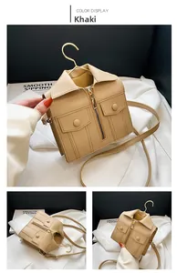 Detail view of khaki jacket-style shoulder bag with zipper and flap pockets