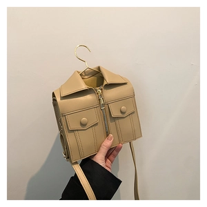 Detailed view of khaki blazer-shaped crossbody bag featuring metal hanger hook and zippers