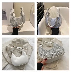 Detailed views of a white crescent shoulder bag with sparkly rhinestones and silver hardware
