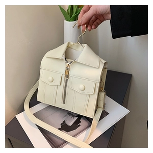 Macro shot of off-white leather shoulder bag with creative motorcycle jacket design details