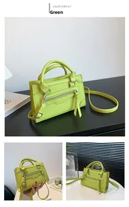 Detail view of lime green crossbody handbag with dual handles and metal zipper accents