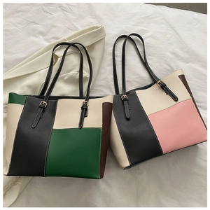 Detail of multi-color tote bags with adjustable leather straps and fine pebble texture