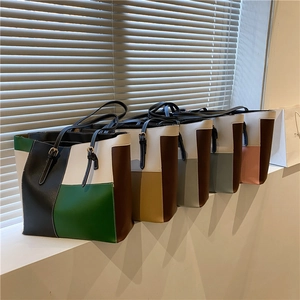 Fashionable large capacity color-block leather tote bags for women with adjustable straps