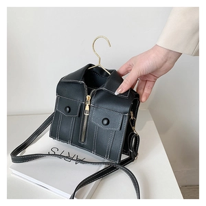 Detail of creative leather jacket shaped shoulder bag with hanger handle and golden zippers