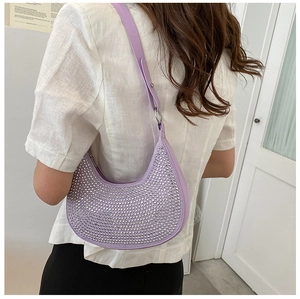 Detailed view of purple crescent bag with sparkling silver rhinestones and metal chain