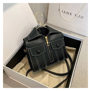 Close-up of black biker jacket style crossbody bag with metal zipper and creative hanger hook