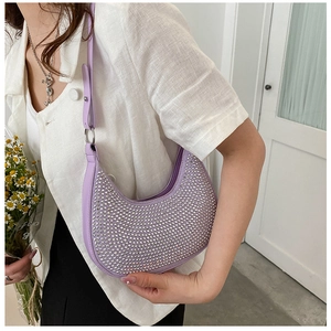Detailed view of lilac crescent underarm bag with sparkling rhinestones and silver chain
